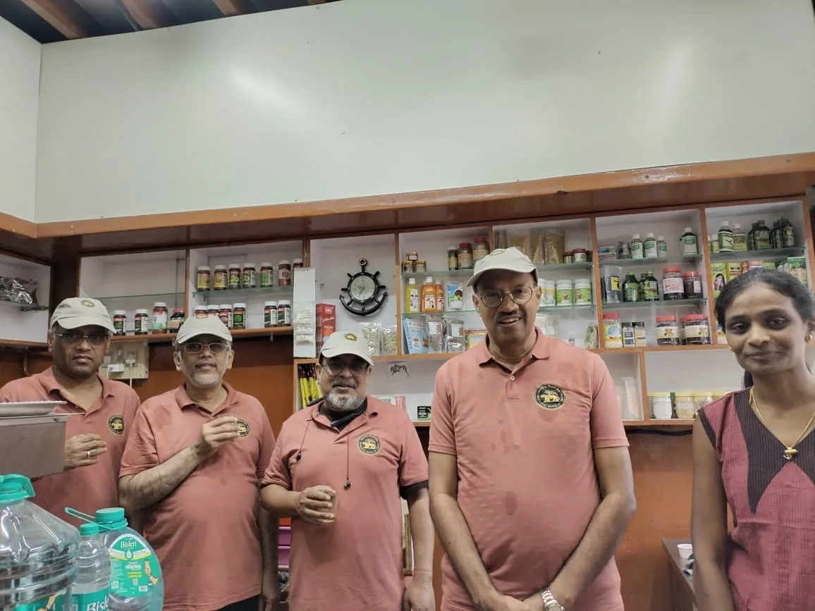 A group visiting the Giri Coffee Works counter in Mysuru