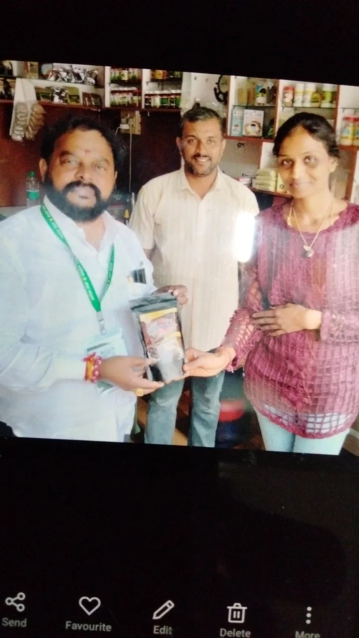 Guests with a Giri Coffee Works appreciation certificate at the shop