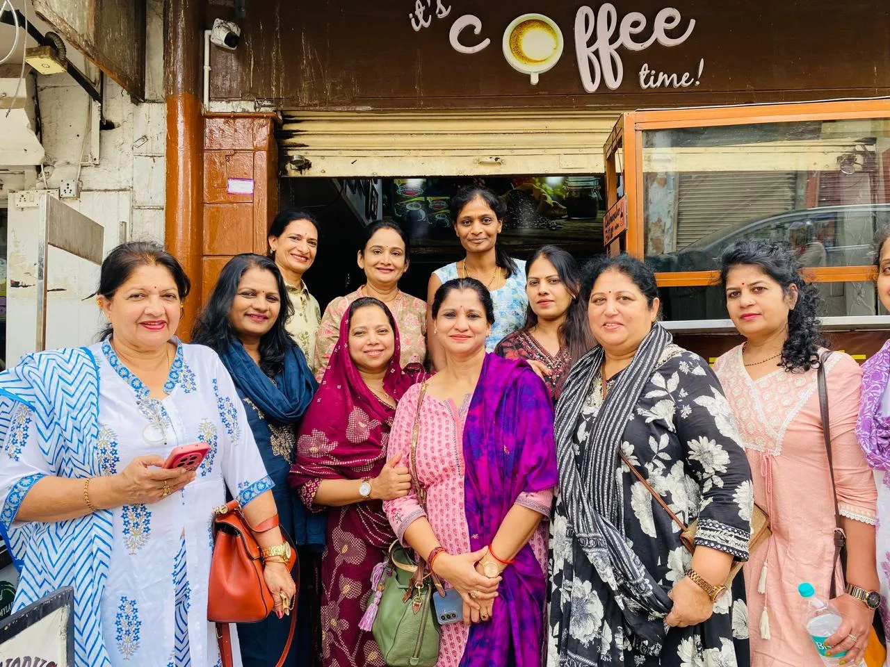 A group of regulars outside the Giri Coffee Works counter in Nazarbad, Mysuru